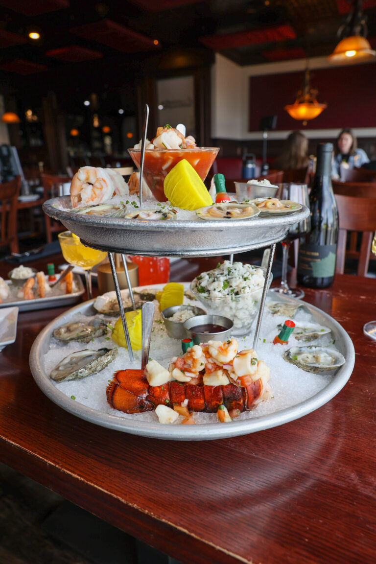 Two-tier seafood tower with oysters, shrimp and lobster