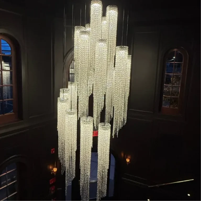 Cascading crystal chandelier above the entrance at Sinner's Kenilworth, framed by arched windows