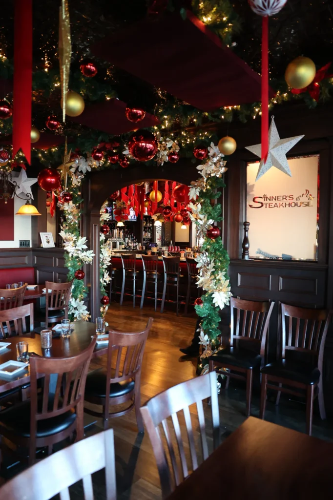 Garland archway with red and gold ornaments leading to the bar in Point Pleasant Beach