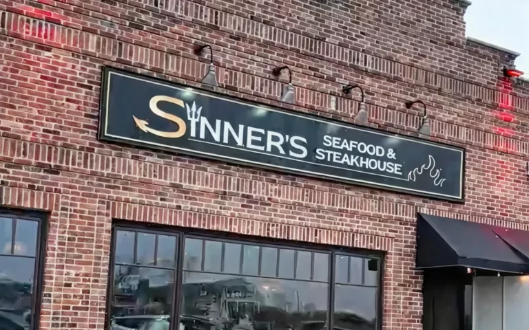 Sinner's Seafood & Steakhouse sign on the brick front of the Point Pleasant Beach, NJ restaurant
